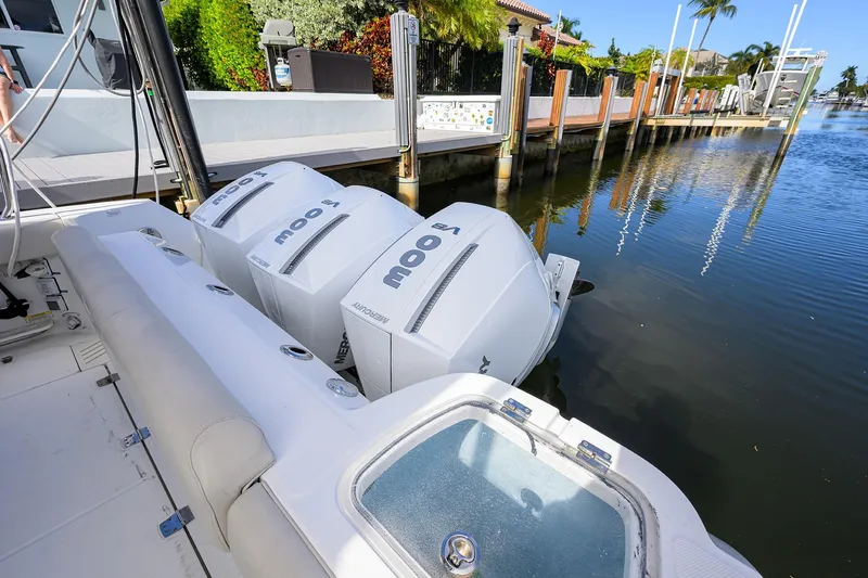 F-troop Yacht Photos Pics 2017 Boston Whaler 345 Conquest with triple Mercury outboard engines docked by waterfront.