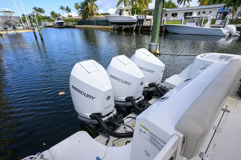 F-troop Yacht Photos Pics 2017 Boston Whaler 345 Conquest with triple Mercury outboard engines docked by the water.