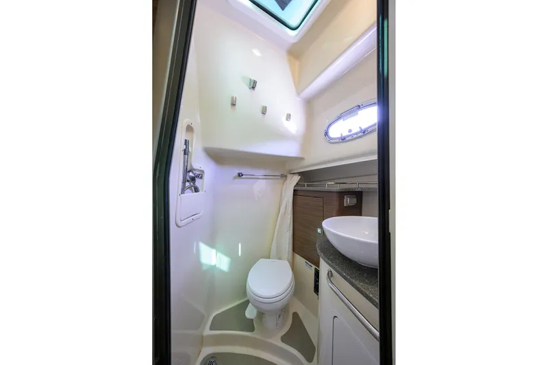 F-troop Yacht Photos Pics 2017 Boston Whaler 345 Conquest boat bathroom interior with toilet and sink.