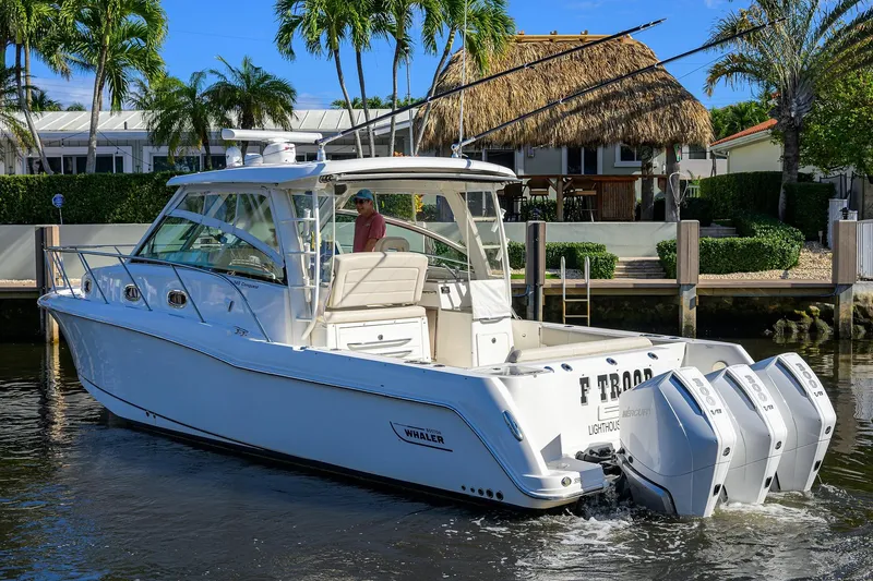 F-troop Yacht Photos Pics 2017 Boston Whaler 345 Conquest boat with triple Mercury engines on a sunny day.