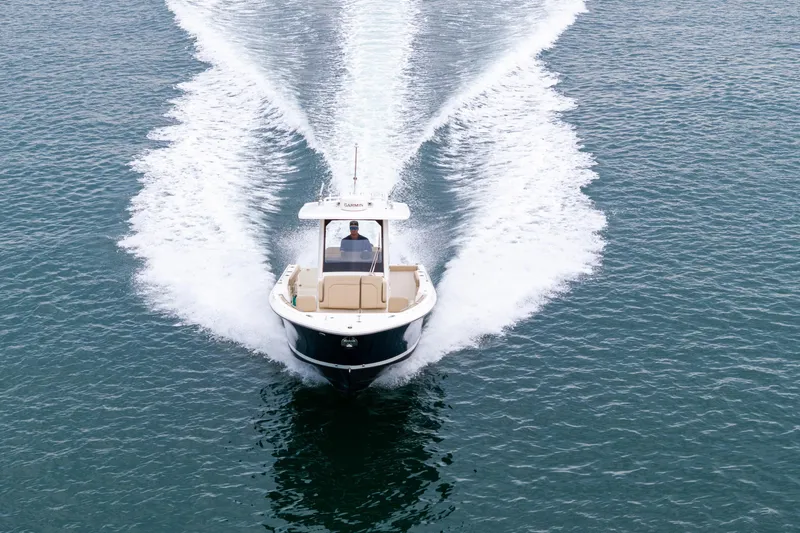 Little Perspective Yacht Photos Pics 2019 Pursuit S 288 Sport boat cruising on open water, creating a wake.