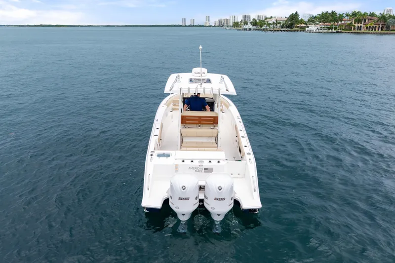Little Perspective Yacht Photos Pics 2019 Pursuit S 288 Sport boat on open water, rear view with twin engines.
