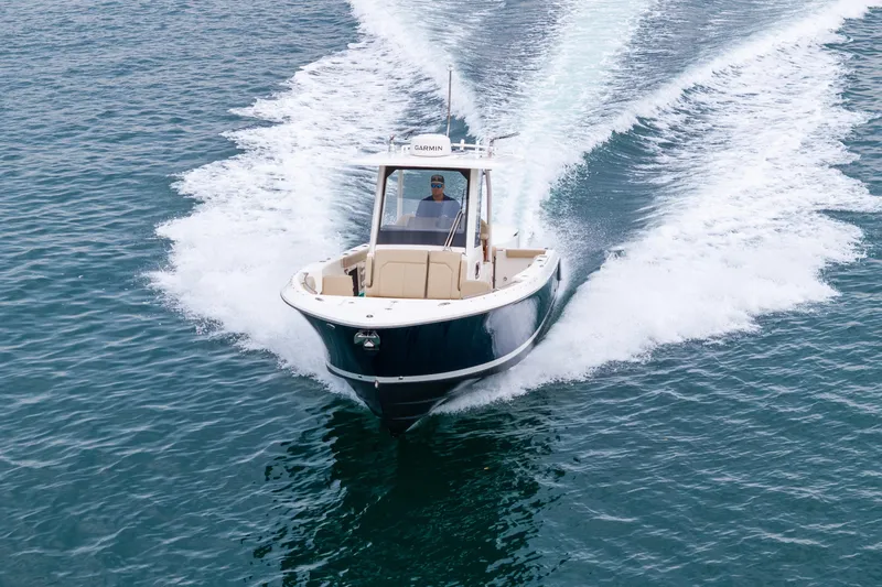 Little Perspective Yacht Photos Pics 2019 Pursuit S 288 Sport boat cruising on open water.