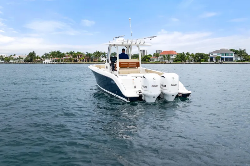 Little Perspective Yacht Photos Pics 2019 Pursuit S 288 Sport boat on water with dual Yamaha engines.