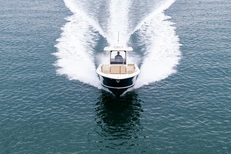 Little Perspective Yacht Photos Pics 2019 Pursuit S 288 Sport boat cruising on open water, creating a dynamic wake.