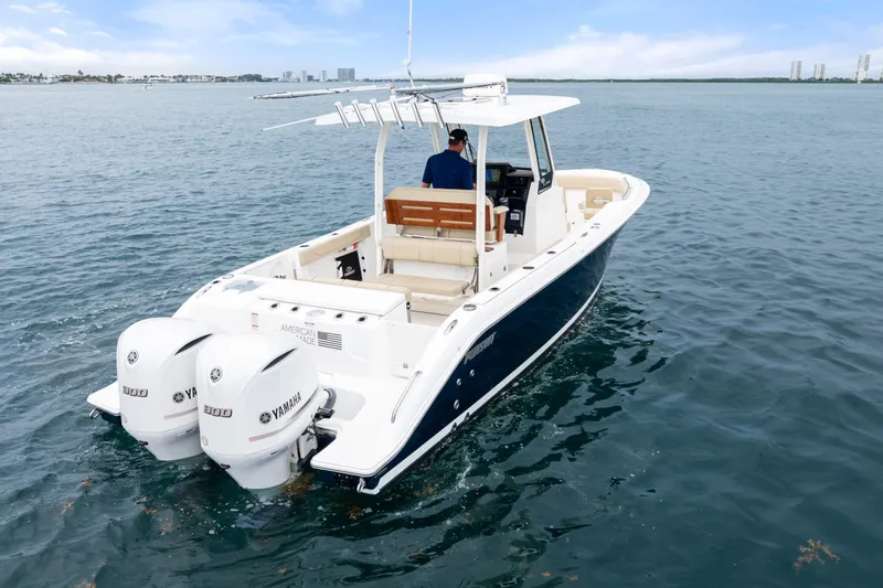 Little Perspective Yacht Photos Pics 2019 Pursuit S 288 Sport boat with dual Yamaha engines on open water.