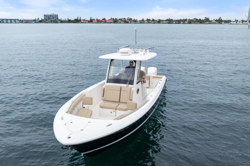 Little Perspective Yacht Photos Pics 2019 Pursuit S 288 Sport boat cruising on calm waters.