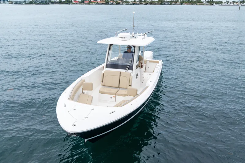 Little Perspective Yacht Photos Pics 2019 Pursuit S 288 Sport boat cruising on calm waters.