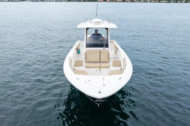 Little Perspective Yacht Photos Pics 2019 Pursuit S 288 Sport boat on calm water, front view.
