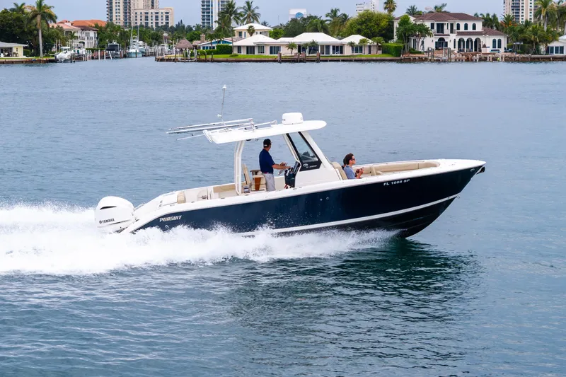 Little Perspective Yacht Photos Pics 2019 Pursuit S 288 Sport boat cruising on a scenic waterfront.