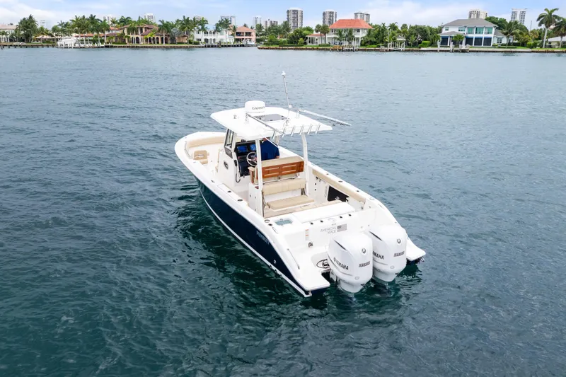 Little Perspective Yacht Photos Pics 2019 Pursuit S 288 Sport boat on calm water, featuring twin Yamaha engines.