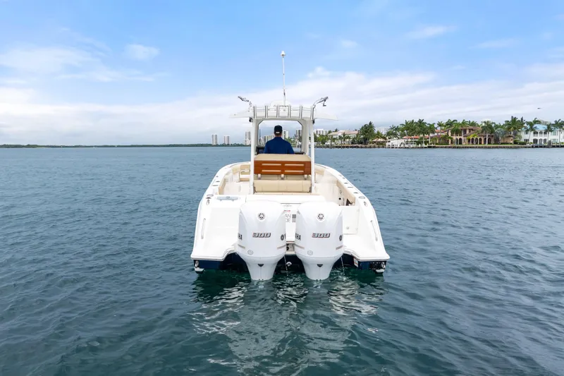Little Perspective Yacht Photos Pics 2019 Pursuit S 288 Sport boat on calm water, scenic coastal background.