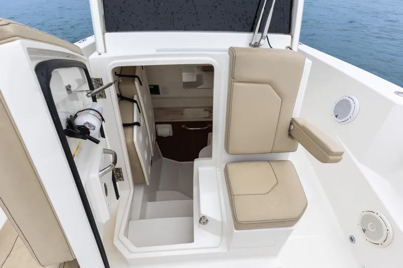 Little Perspective Yacht Photos Pics 2019 Pursuit S 288 Sport boat interior with seating and storage compartments.