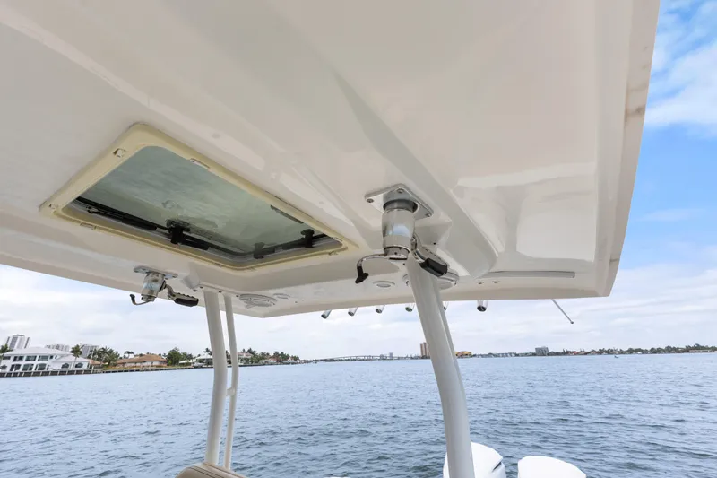 Little Perspective Yacht Photos Pics 2019 Pursuit S 288 Sport boat canopy with ocean view in the background.