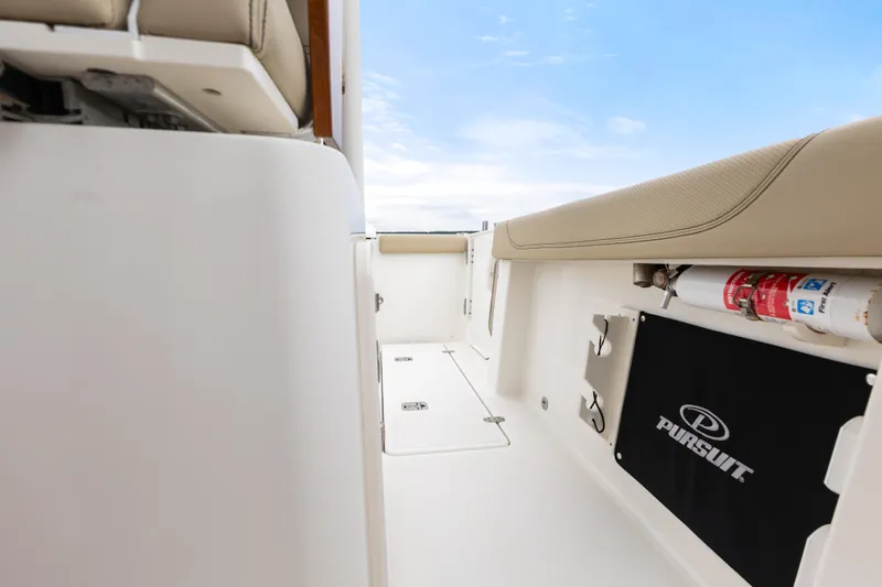 Little Perspective Yacht Photos Pics 2019 Pursuit S 288 Sport boat interior with seating and storage compartments.