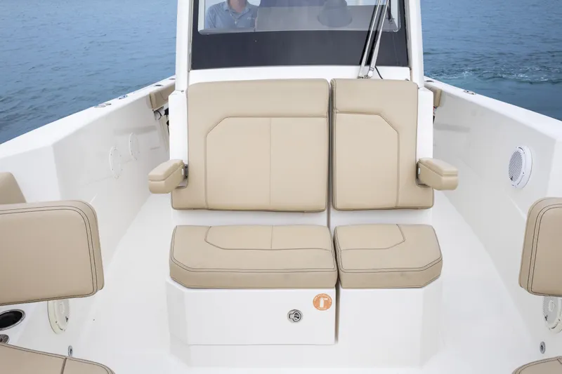 Little Perspective Yacht Photos Pics 2019 Pursuit S 288 Sport boat interior with beige seating and armrests.