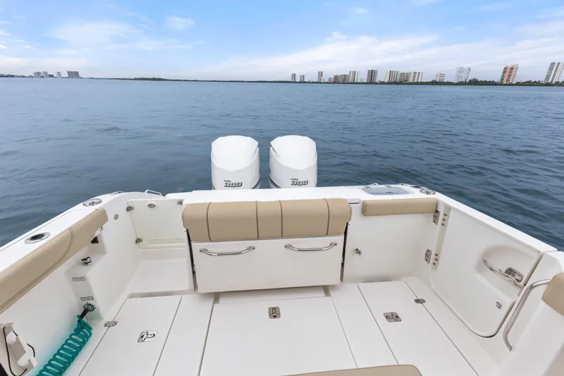 Little Perspective Yacht Photos Pics 2019 Pursuit S 288 Sport boat with dual engines on calm water.