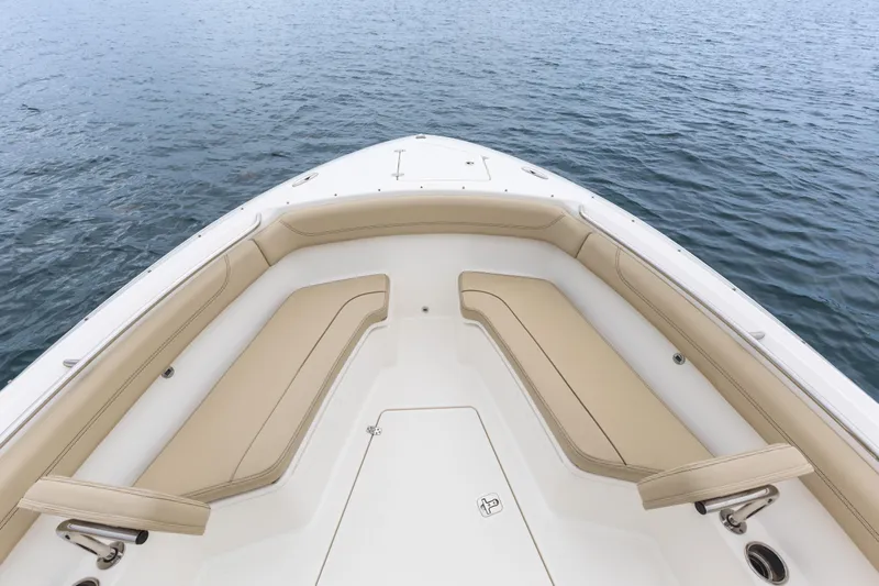 Little Perspective Yacht Photos Pics 2019 Pursuit S 288 Sport boat bow with tan seating on calm water.