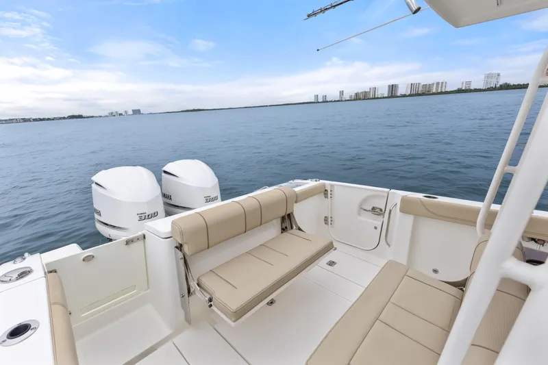 Little Perspective Yacht Photos Pics 2019 Pursuit S 288 Sport boat with Yamaha engines on calm water.