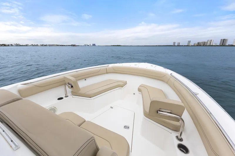 Little Perspective Yacht Photos Pics 2019 Pursuit S 288 Sport boat interior with beige seating on open water.