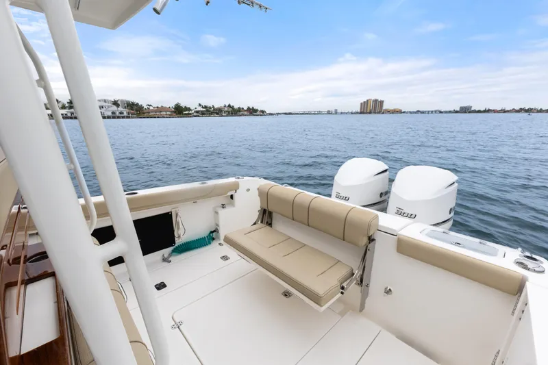 Little Perspective Yacht Photos Pics 2019 Pursuit S 288 Sport boat with twin engines on calm water.