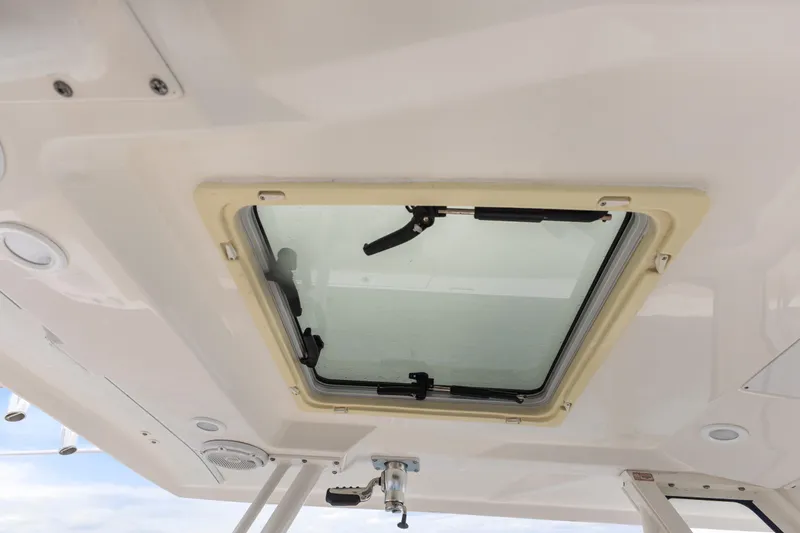 Little Perspective Yacht Photos Pics 2019 Pursuit S 288 Sport boat hatch, interior view with open window.