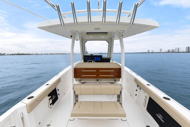 Little Perspective Yacht Photos Pics 2019 Pursuit S 288 Sport boat interior with seating and ocean view.