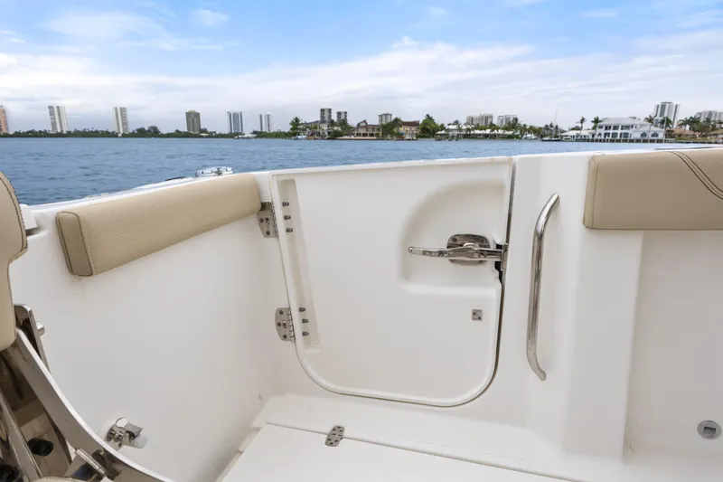 Little Perspective Yacht Photos Pics 2019 Pursuit S 288 Sport boat interior with water view and city skyline.