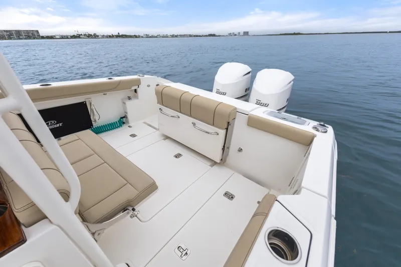Little Perspective Yacht Photos Pics 2019 Pursuit S 288 Sport boat interior with seating and twin engines on calm water.