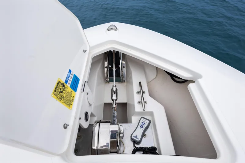Little Perspective Yacht Photos Pics 2019 Pursuit S 288 Sport boat anchor compartment with chain and control panel.