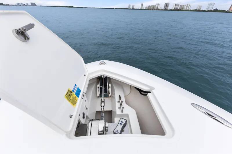 Little Perspective Yacht Photos Pics 2019 Pursuit S 288 Sport boat anchor compartment open on calm water.