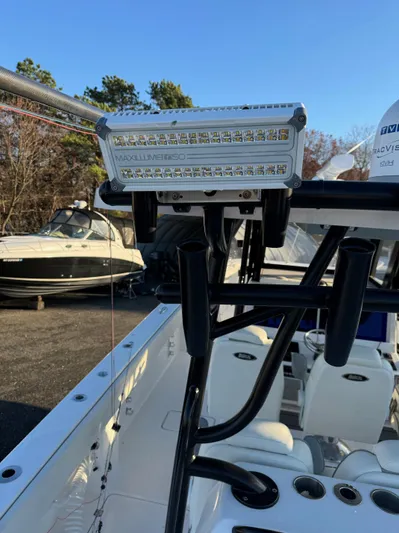  Yacht Photos Pics LED light on 2022 Invincible 40 Catamaran, docked with other boats in background.