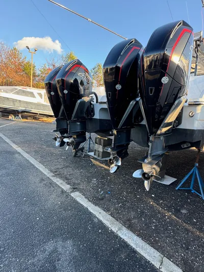  Yacht Photos Pics 2022 Invincible 40 Catamaran with triple outboard engines in a boatyard.