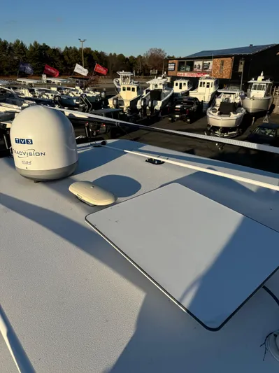  Yacht Photos Pics 2022 Invincible 40 Catamaran on display at a boat dealership.