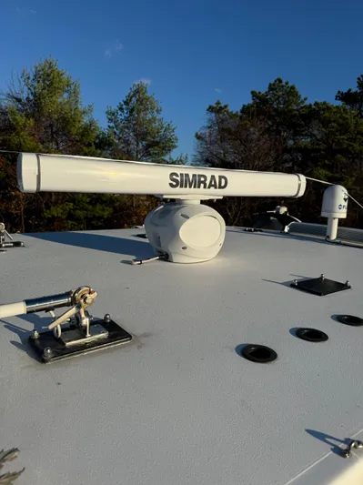  Yacht Photos Pics Simrad radar on 2022 Invincible 40 Catamaran under clear blue sky.