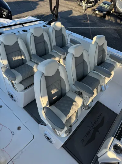  Yacht Photos Pics Luxurious seating on 2022 Invincible 40 Catamaran, featuring plush gray and white upholstery.