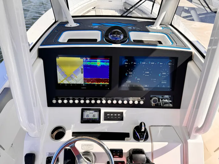  Yacht Photos Pics 2023 Regulator 28 boat dashboard with navigation and control screens.