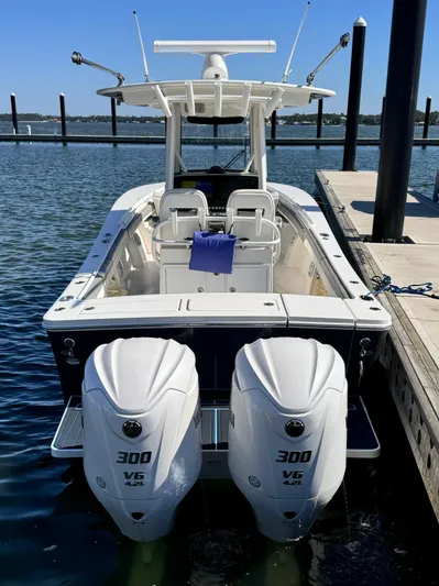  Yacht Photos Pics 2023 Regulator 28 boat with twin 300 V6 engines docked at marina.