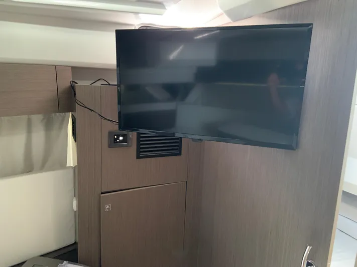  Yacht Photos Pics Interior of 2025 Jeanneau NC 1095 Coupe with mounted flat-screen TV.