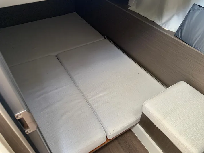  Yacht Photos Pics Interior cabin of 2025 Jeanneau NC 1095 Coupe with cushioned seating.