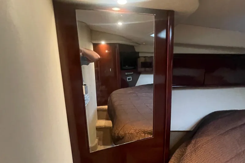 Maddie Janes Yacht Photos Pics Interior cabin of 2009 Sea Ray 40 Sundancer yacht with mirror and bed.