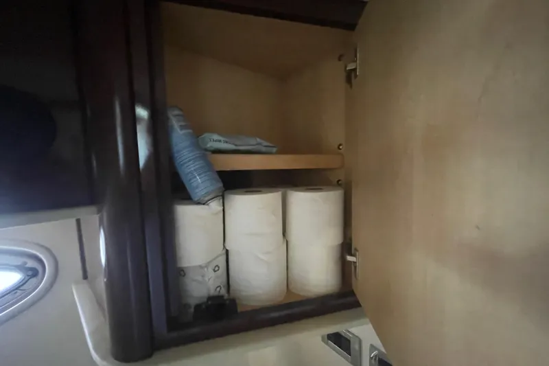 Maddie Janes Yacht Photos Pics Cabinet storage in 2009 Sea Ray 40 Sundancer yacht with toilet paper and towels.