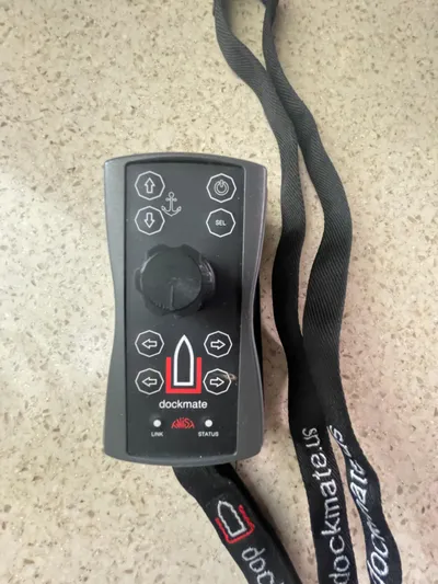 Maddie Janes Yacht Photos Pics Dockmate remote control for Sea Ray 40 Sundancer 2009, featuring directional buttons and lanyard.