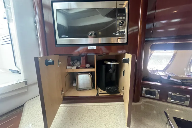 Maddie Janes Yacht Photos Pics 2009 Sea Ray 40 Sundancer kitchen with microwave and storage cabinets.