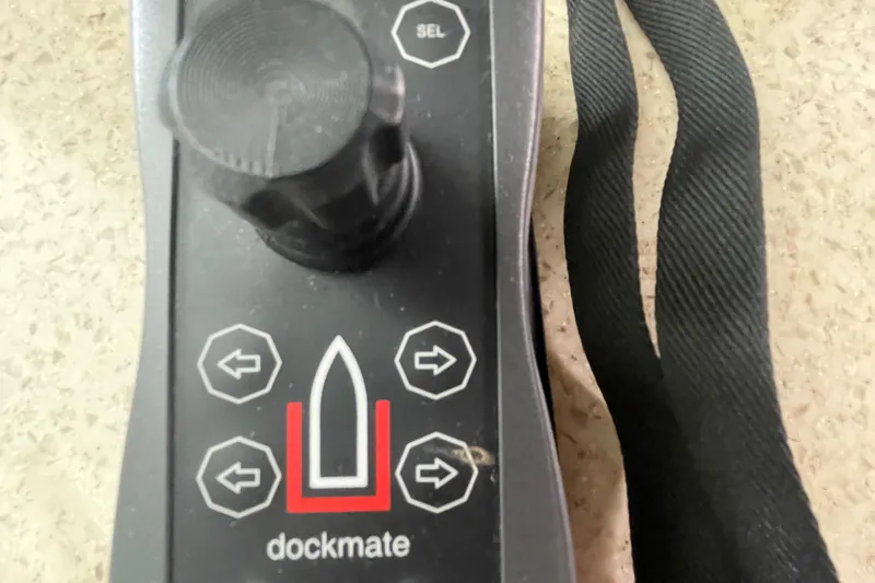 Maddie Janes Yacht Photos Pics Dockmate control panel for Sea Ray 40 Sundancer 2009 boat, featuring directional buttons.