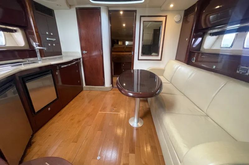 Maddie Janes Yacht Photos Pics Interior of 2009 Sea Ray 40 Sundancer yacht with modern kitchen and seating area.