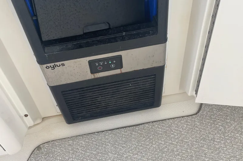 Maddie Janes Yacht Photos Pics Ice maker on a 2009 Sea Ray 40 Sundancer yacht, featuring a compact design.