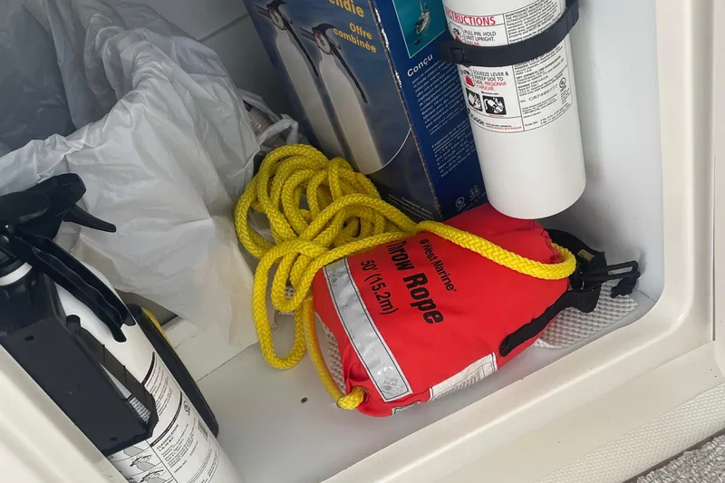 Maddie Janes Yacht Photos Pics Storage compartment with safety equipment on a 2009 Sea Ray 40 Sundancer boat.