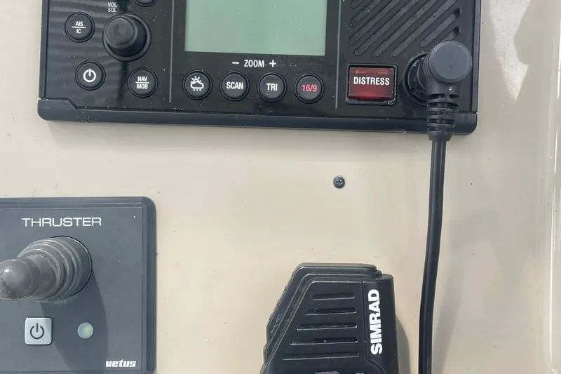 Maddie Janes Yacht Photos Pics Control panel of a 2009 Sea Ray 40 Sundancer boat with Simrad radio and thruster controls.