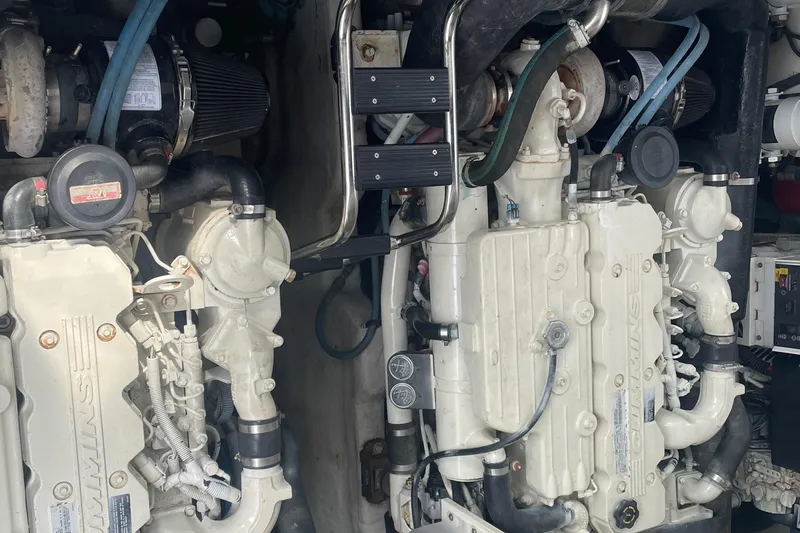 Maddie Janes Yacht Photos Pics Engine room of a 2009 Sea Ray 40 Sundancer, showcasing dual marine engines.